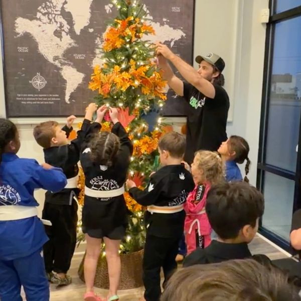 East Carolina Brazilian Jiu-Jitsu Mitey Mite students displaying for that which they are thankful.
