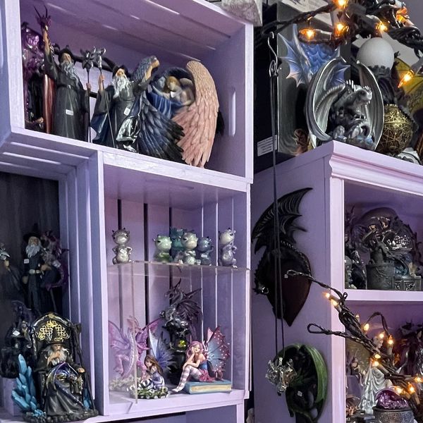 Enchanting display of fairies at a metaphysical shop.