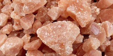 Close-up of coarse pink Himalayan salt crystals.