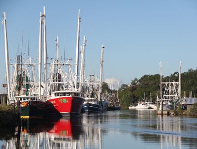 Colorful shrimpboats  line the docks of the coastal town of Bayou La Batre, AL. Their massive outrig