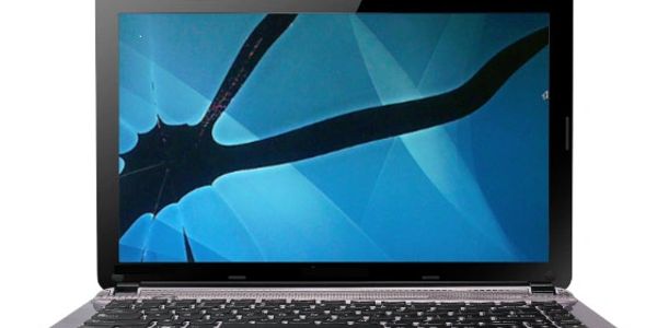Laptop with a cracked screen showing spiderweb damage.