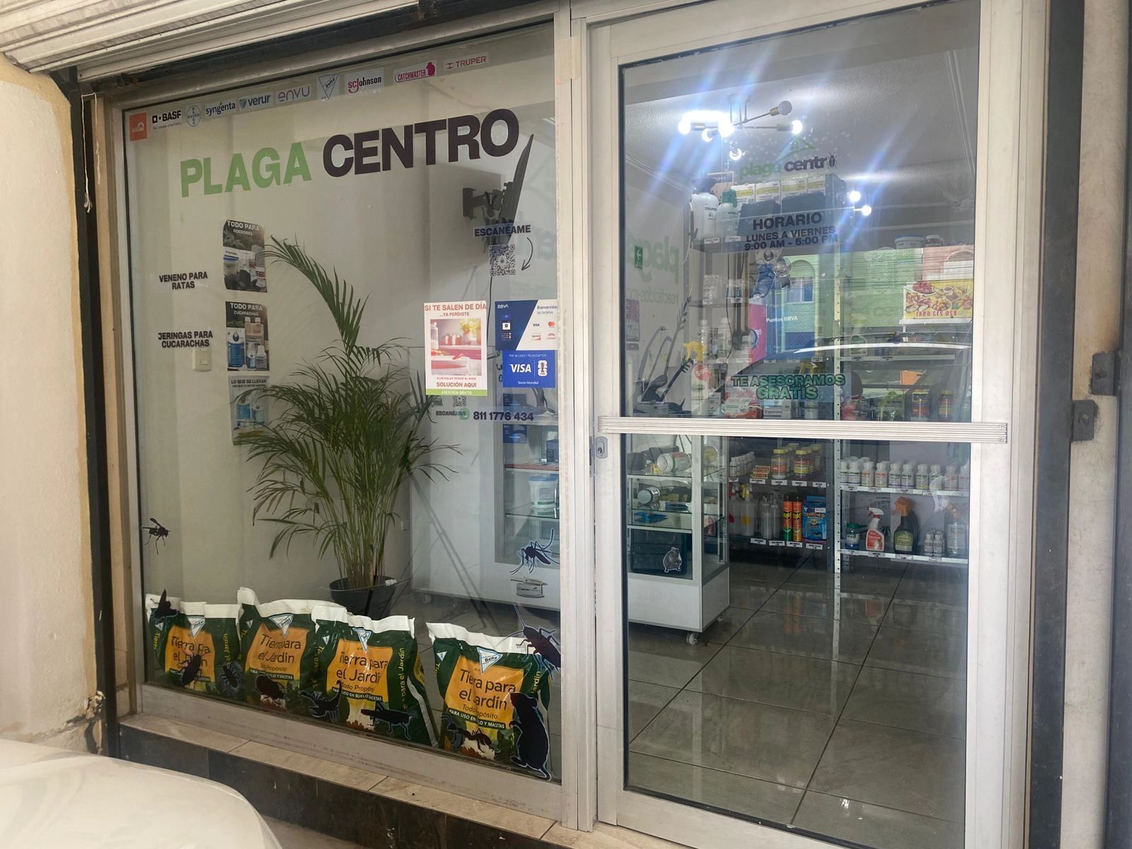 Storefront of Plaga Centro selling pest control products and garden soil.