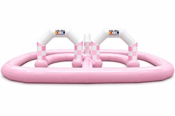 Pink inflatable race track with checkered arches.