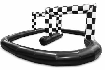 Inflatable black and white checkered race gates on a track.