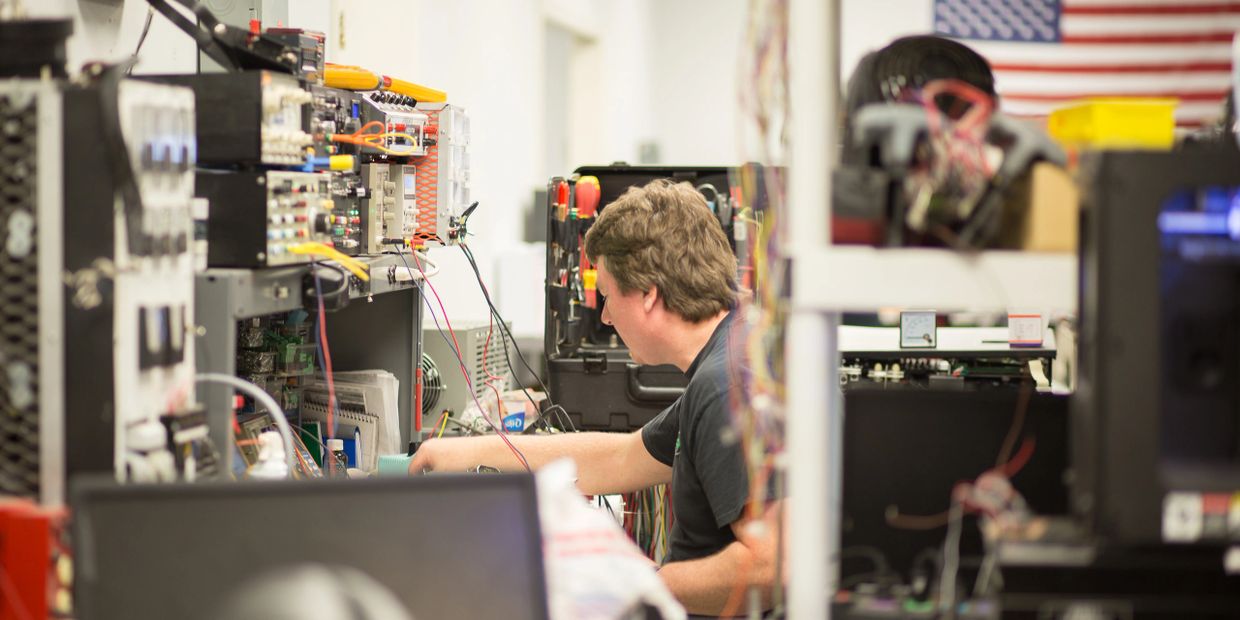 man working in an industrial electronics shop