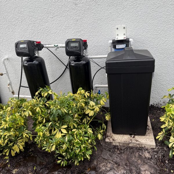 Water filtration system installed outdoors.