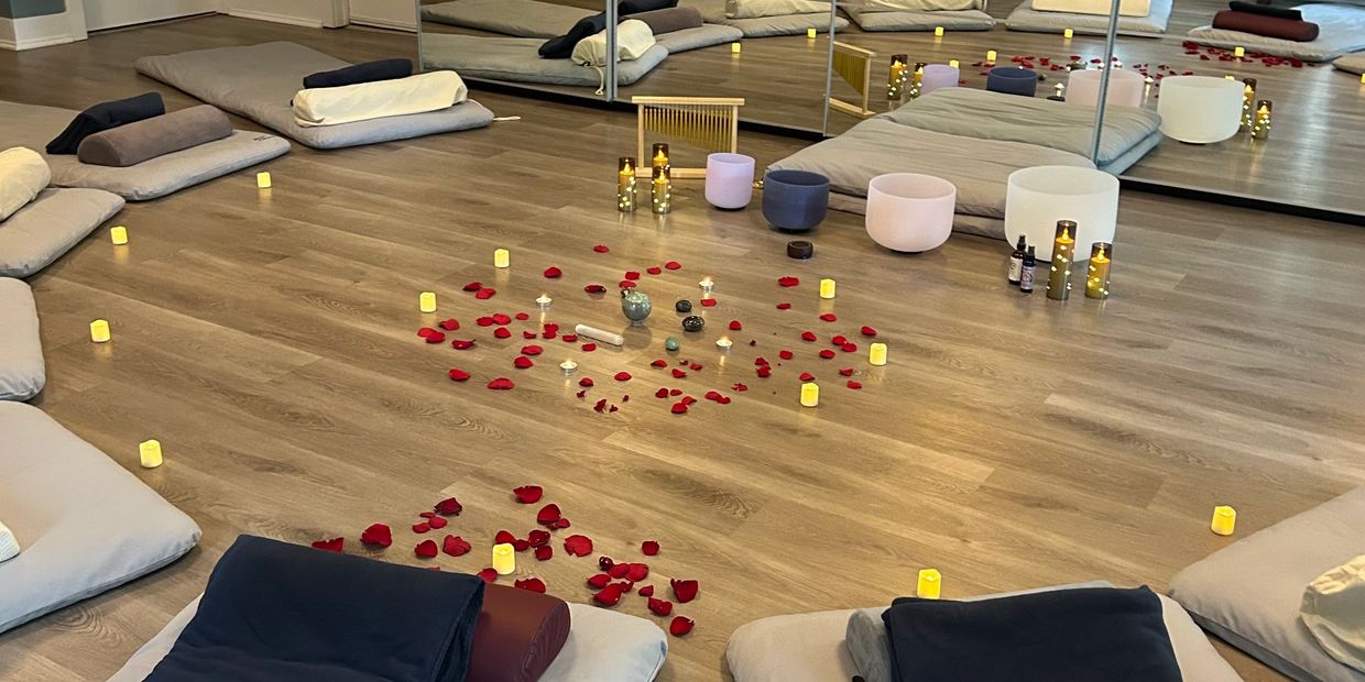 Crystal sound bowls and candles prepared for a private event in Chicago wellness studio.