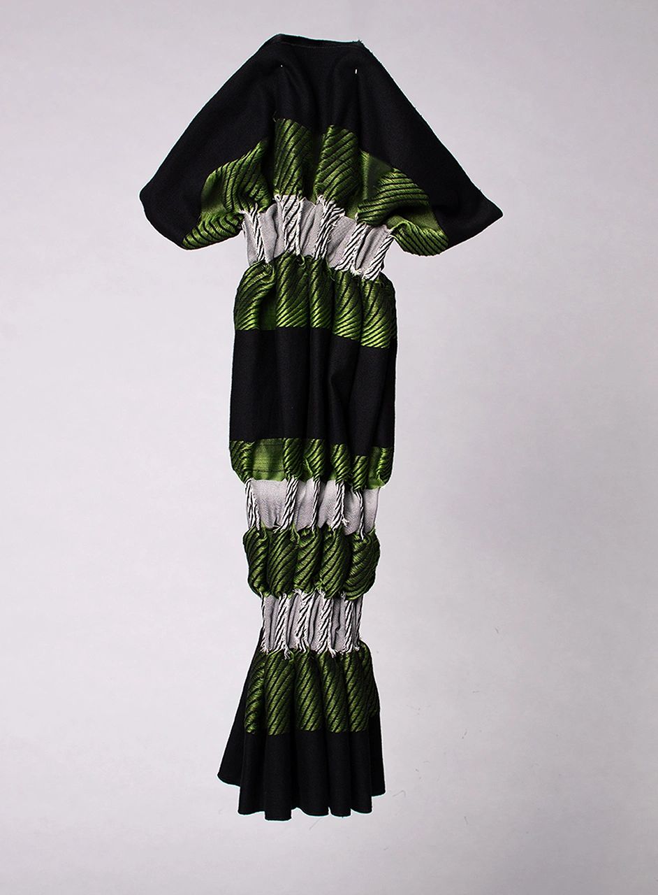 Long dress with green and white striped pattern and black accents.