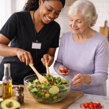 A nurse helps an elderly woman prepare a fresh salad with vegetables.