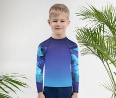 Children's ocean coral rash guard | little boy wearing purple and blue sea urchin rash guard 