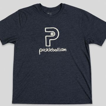 Navy blue t-shirt with a unique pickleball-themed logo and the word 'pickleballism'.
