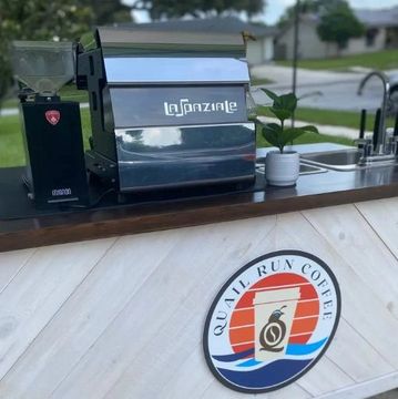 Elegant mobile coffee cart serving crafted espresso drinks