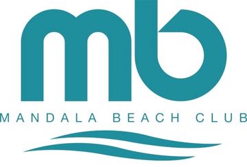 Logo for Mandala Beach Club with stylized 'mb' and wave design.