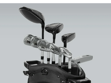 Set of PXG golf clubs in a black bag against a gray background.