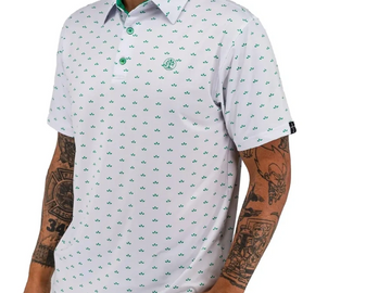 Man wearing a white polo shirt with green patterns and khaki pants.