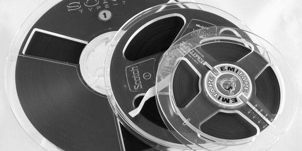 Reels of audio tape from reel-to-reel machines, ready for digital transfer to preserve your family’s