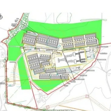 Architectural site plan showing building layouts with green landscaping areas.