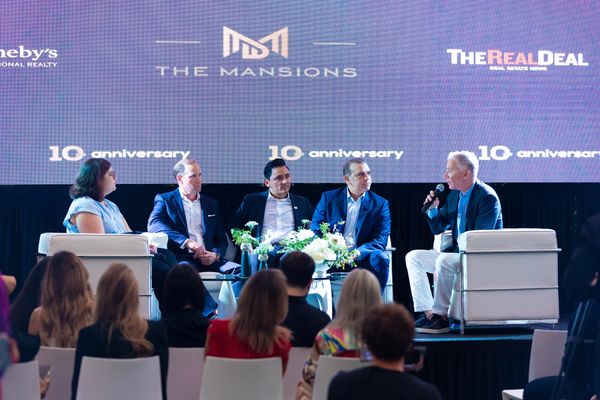 Panel discussion at a real estate event celebrating 10 years of The Mansions®