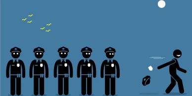 Stick figure throwing paper ball while five police officers watch.