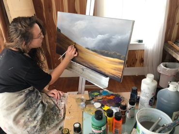 julia strand painting landscape portrait painting of golden fields with a storm on the horizon 