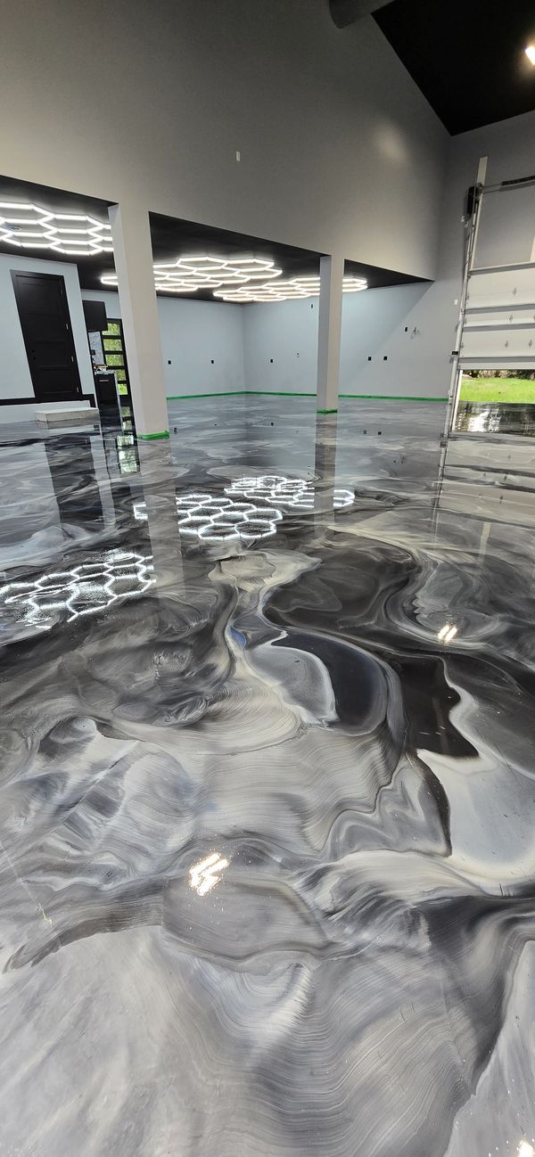 Metallic epoxy floor close-up showing marbled swirl pattern.