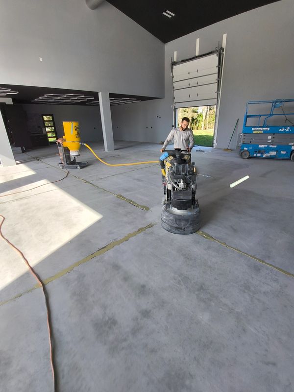 Floor grinding prep for a metallic floor.