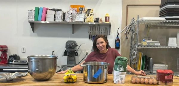 Owner baking treats in kitchen