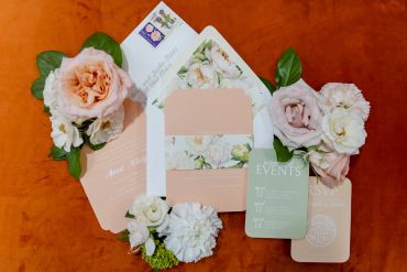 Elegant floral-themed wedding invitation set.