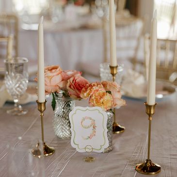 all-inclusive NC wedding venue featuring reception centerpiece with florals and candles