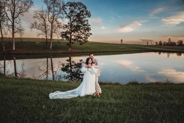 The Emerald Hill outdoor wedding venue near Charlotte, NC featuring a couple at our reflective pond