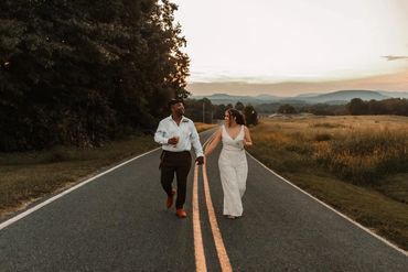 The Emerald Hill outdoor wedding venue near Charlotte, NC featuring couple at sunset with mountains