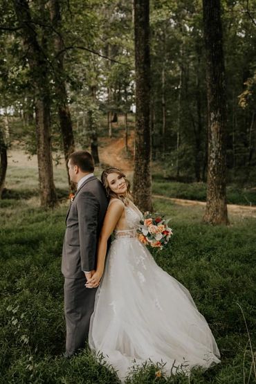 The Emerald Hill outdoor wedding venue near Charlotte, NC featuring a couple in the woods