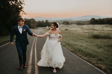 The Emerald Hill outdoor wedding venue near Charlotte, NC featuring couple at sunset with mountains