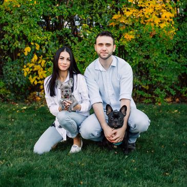 Photo of owner, partner,and their 2 french bulldogs