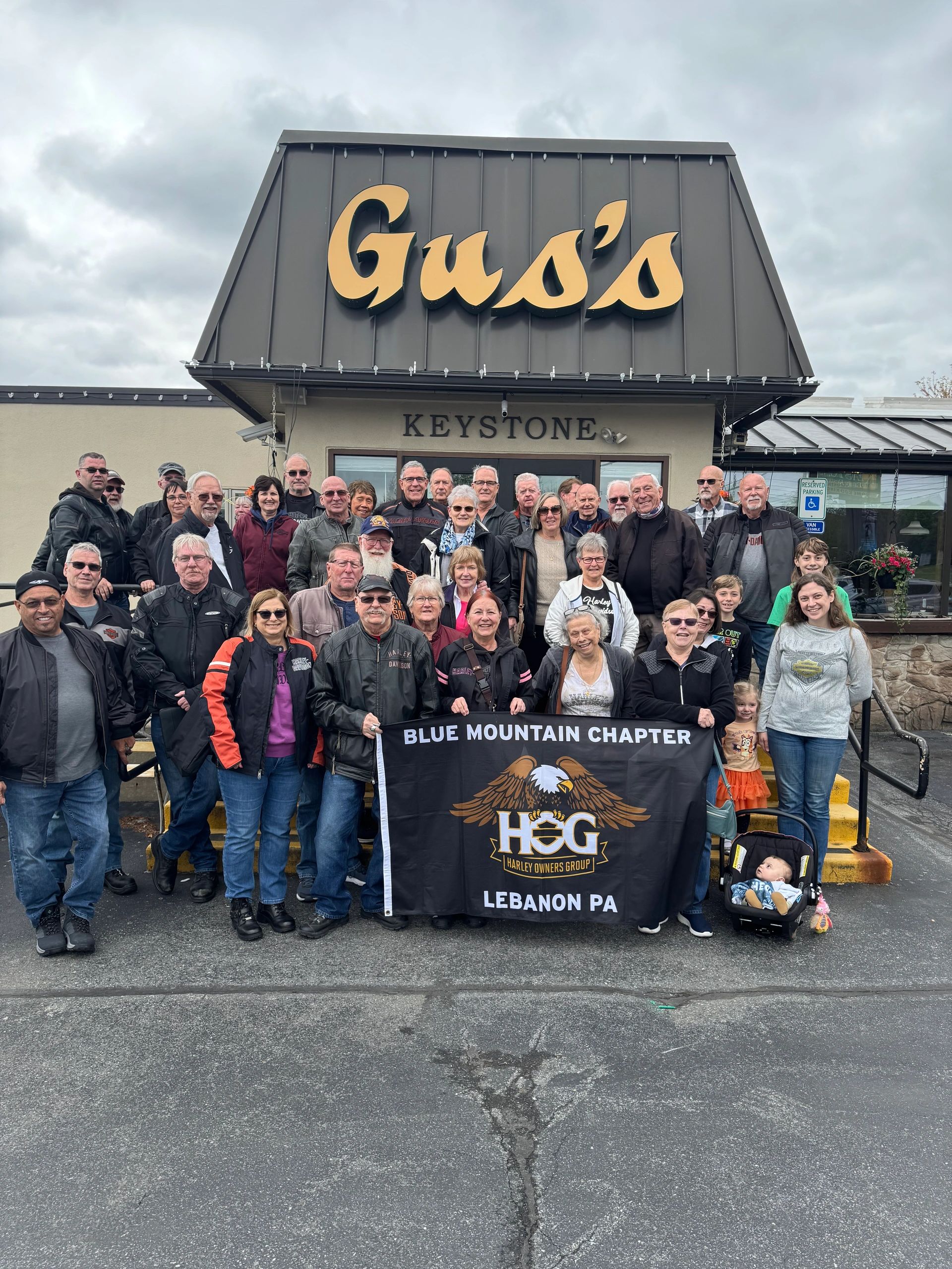 Group photo of the Blue Mountain Chapter Harley Owners Group at Gus's Keystone.