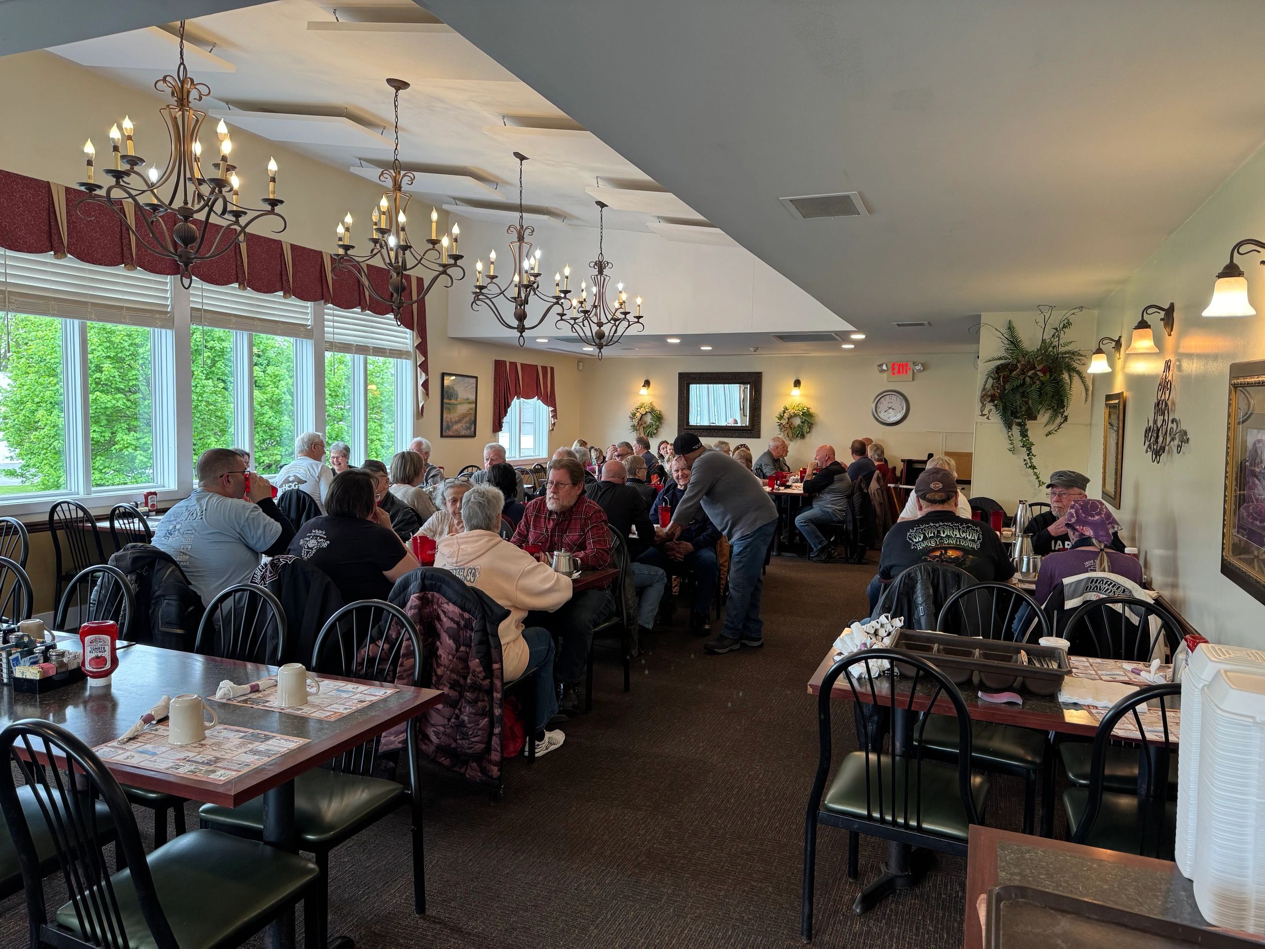 A cozy restaurant filled with diners enjoying their meals and conversations.