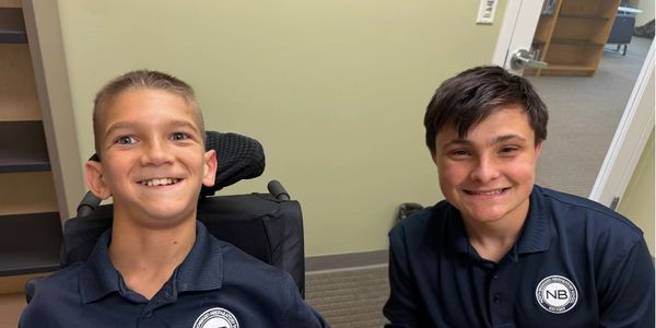 Enjoying some laughs with a middle school student after a sports talk.