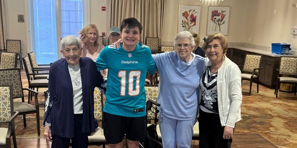 Spending time with some of the residents after a sports talk at a retirement home.