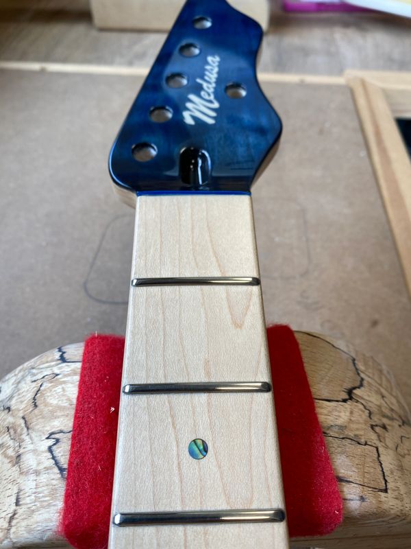 Guitar fret level crown and dress 