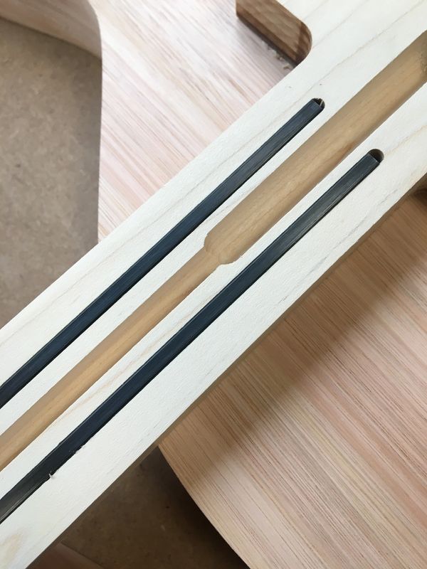 Guitar neck truss rod and carbon fibre reinforcement rod