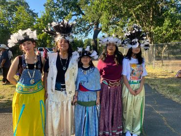 A group of young ladies prepare to dance.