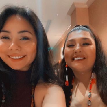 Two Native women enjoying social time.