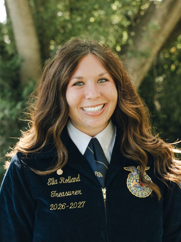 Portrait of a smiling young woman in FFA jacket.