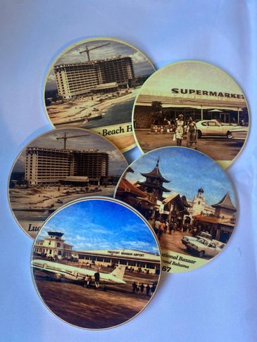Vintage souvenir plates featuring scenes from Nassau, Bahamas.