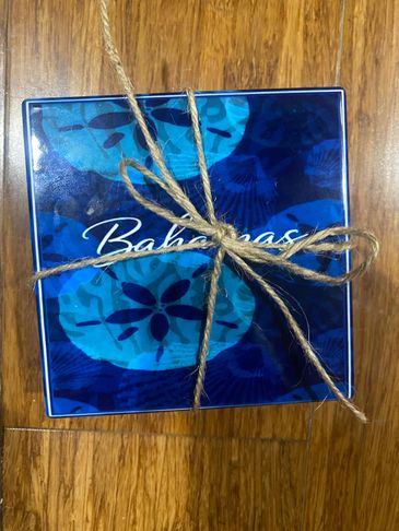 A blue Bahama-themed gift box tied with a rustic twine bow.