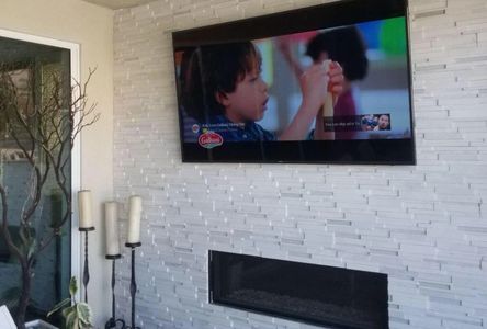 tv mounted in the backyard