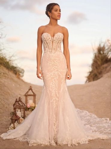 Bride in elegant strapless lace wedding gown.