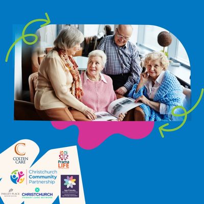 Group of people sat gathered around a brochure