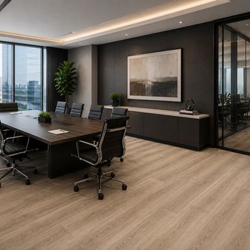 Modern conference room with sleek furniture and large windows.