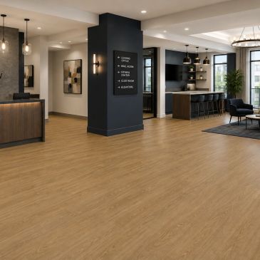 Modern open lobby with wood flooring and seating.